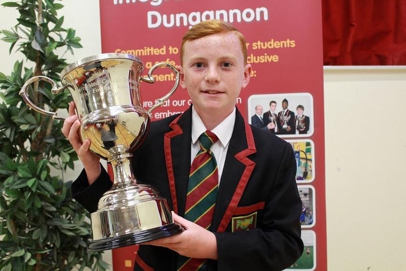 Mason McAdam receives the Irish Football Association Cup at Year 10 Prize-Giving at ICD. Credit: Ita Darragh
