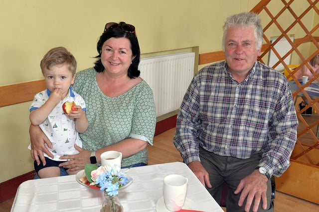 Supporting theThomas Street Methodist Youth Fellowship fundraising coffee morning are from left, Thomas Craig (2), Alison Irvine and John Anderson. PT26-211.