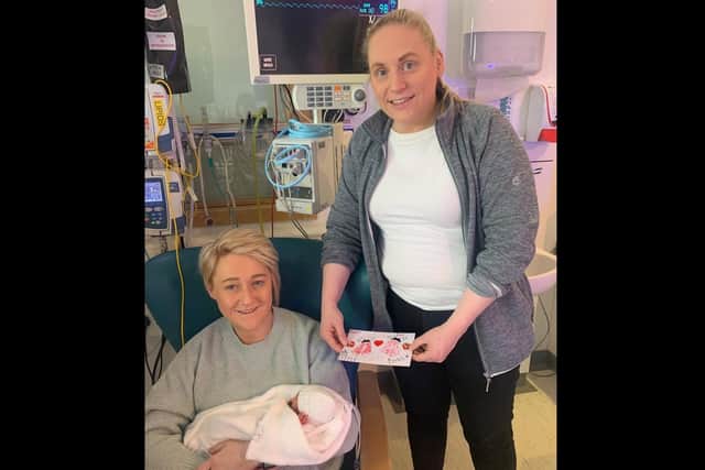 Mums Nikita and Laura Johnston with one of the handcrafted Valentine's Day cards. Pic credit: SEHSCT