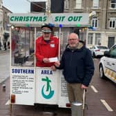 Rev. Geoff Wilson, Dean of Dromore, presents Mr. John Dalzell with an amazing £4751.74 towards his Christmas Sit-Out for Southern Area Hospice. Pic credit: Southern Area Hospice Services