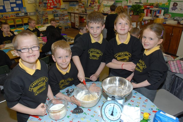 Regan, Reuben, Lawrence, Chloe and Louise busy mixing up the pancake batter at Larne and Inver Primary School on Pancake Day 2011.