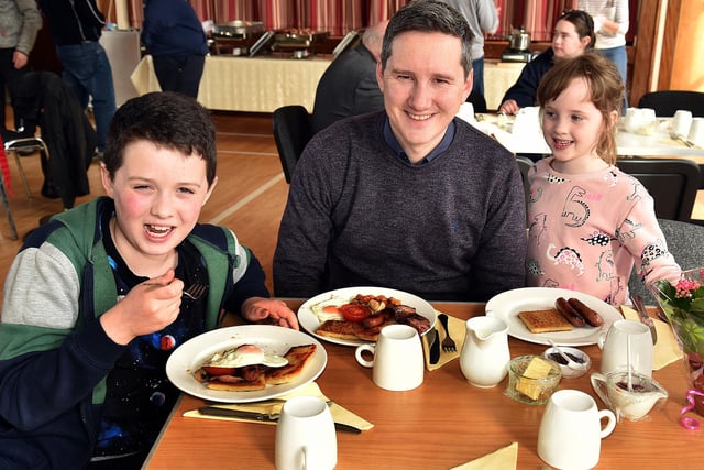 The Cunningham family enjoying the St Luke's Parish Big Breakfast. Included are dad Simon, Joshua (10) and Olivia (6). PT13-203.