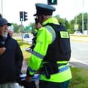 Police with retired Baptist Pastor Clive Johnston at Causeway Hospital in Coleraine on Sunday, July 7, 2024.