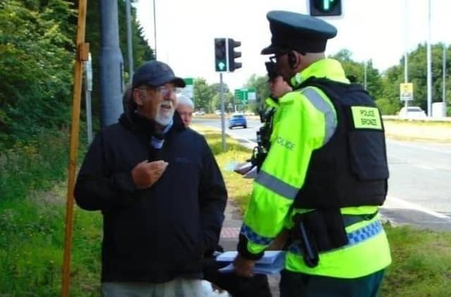Police with retired Baptist Pastor Clive Johnston at Causeway Hospital in Coleraine on Sunday, July 7, 2024.