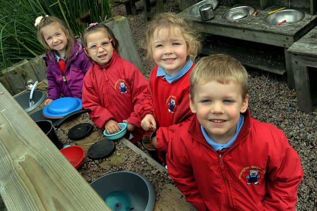 All smiles at the outdoor kitchen at Millington Nursery School are pupils from left Ivon, Iasmina, Heidi and Ollie. PT41-334.