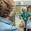 Volunteer delivers emergency food parcel