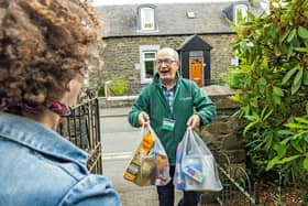 Volunteer delivers emergency food parcel