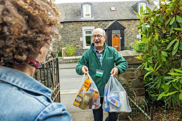 Volunteer delivers emergency food parcel