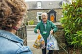 Volunteer delivers emergency food parcel