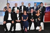 Prizewinners at the Mid-Ulster Business Awards which were held in the Royal Hotel, Cookstown in 2023.  Also included are, compere, Adrian Logan, front left, and Julie McKeown, front centre, of main sponsors, Henry Brothers. Picture: Tony Hendron