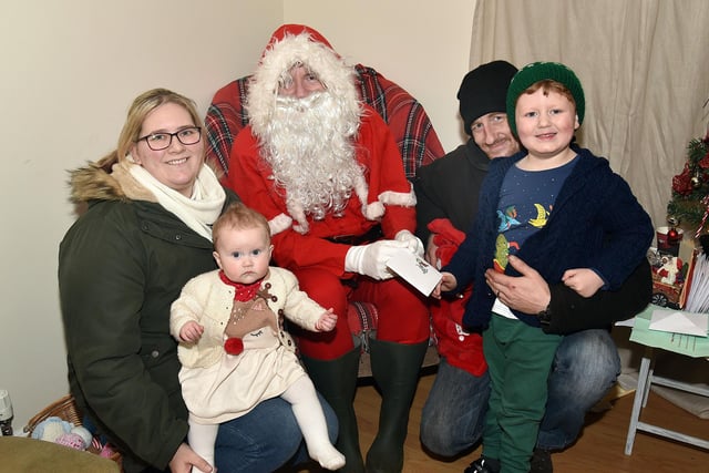 The Smyth family pictured during their visit to Santa at the Knitted Knockers Christmas market. Included from left are, mum, Barbara, Amelia (8 months), dad, David and Hunter (4). PT51-204.