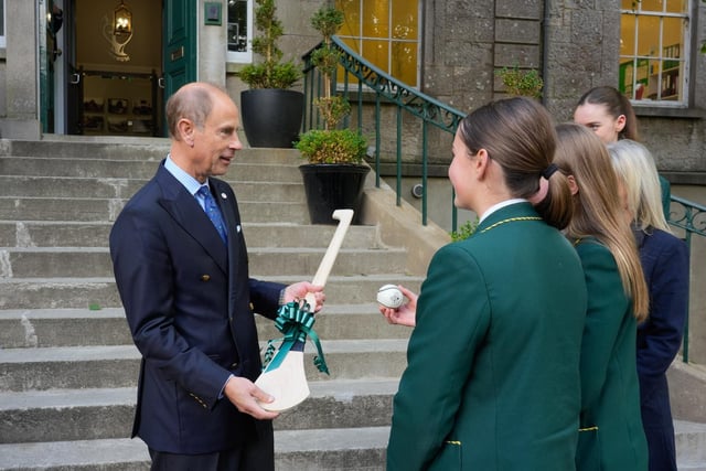 The Duke is presented with a hurl at St Catherine's College.