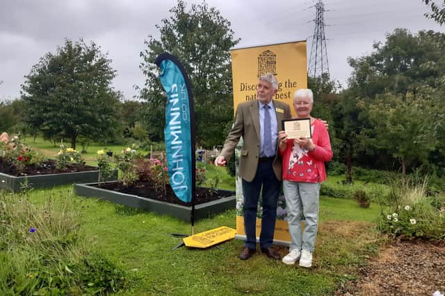 Trevor Edwards, Area Organiser of the National Garden Scheme of NI awarded a plaque plus a grant of £2k to Marie Cullen, Secretary of Taghnevan Allotments in Lurgan, Co Armagh.