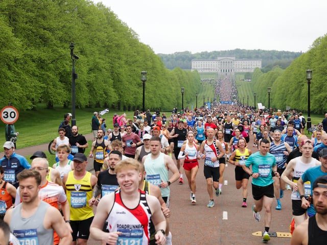 Runners in the Phoenix Energy Belfast City Marathon leaving the grounds of the Stormont Estate.