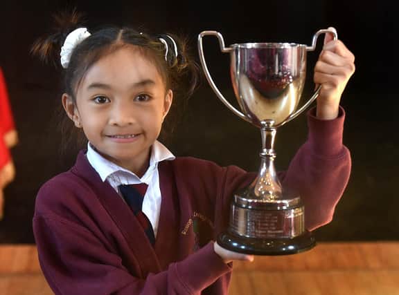 Alexandrea Quibael with her first place trophy won in the Song From A Musical Show section at Portadown Music Festival. PT13-223.