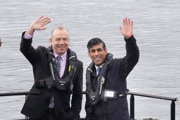 Prime Minister Rishi Sunak and Northern Ireland secretary Chris Heaton Harris during their visit to Belfast yesterday on the General Election campaign trail. Photo: Stefan Rousseau/PA Wire