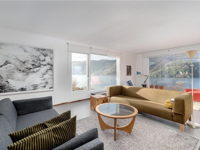 The sitting room has full height picture windows to take full advantage of the magnificent open aspects.