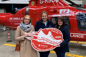 Ramona Vrancut, Emma Kean and Naomi McDonald at their recent visit to Air Ambulance NI’s operational base. Missing from photo are other team relay members Laura Carson and Nuala McAleer.
