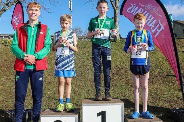 (L-R) The top three finalists in the Boys’ Race at the Flahavan’s Primary School Cross Country League, pictured with Flahavan’s and Athletics NI ambassador Callum Baird: Euan Kelly from Academy Primary School, Saintfield (2nd place), Harry McVeigh from Bunscoil Bheanna Boirche, Castlewellan, (1st place), and Tomas McCloskey from Faughanvale Primary School, Eglinton (3rd place).