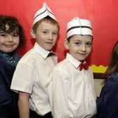 SINGING WAITERS. P3/4 pupils at St Brigid's PS who took the role of 'Waiters and Gospel Singers' during their Christmas Play in 2008