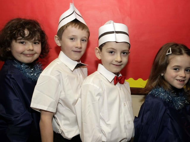 SINGING WAITERS. P3/4 pupils at St Brigid's PS who took the role of 'Waiters and Gospel Singers' during their Christmas Play in 2008