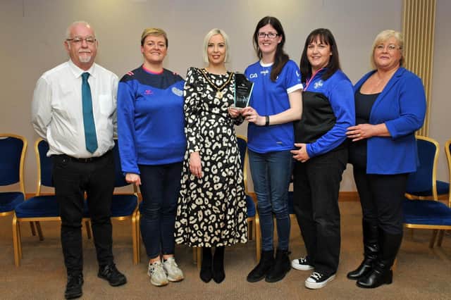 Deputy Lord Mayor, Councillor Sorcha McGeown congratulates Anne-Marie Henderson, Tracey McCavigan and Eileen McGivern from the Clan Na Gael Well Being Committee on winning the Ulster GAA Healthy Club Award. Included are Councillors Liam Mackle and Mary 'Dowd.