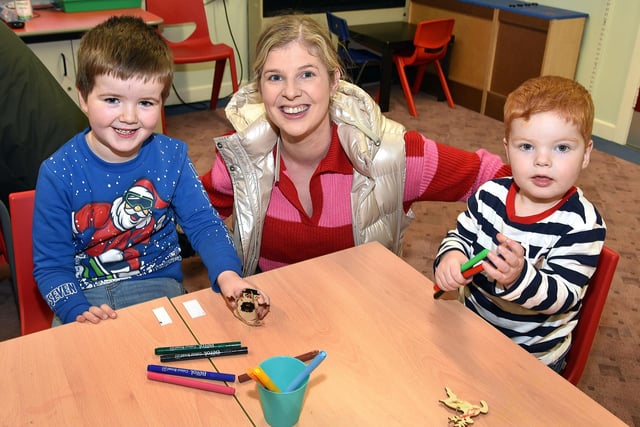 Having fun making Christmas tree ornaments at The Cope Primary School, Loughgall, festive afternoon on Saturday are, from left, Allan Millar (6), Rebekah Allen and William Allen. PT51-205.