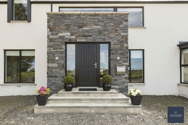 Feature stonework sets off the main entrance to this lovely home.