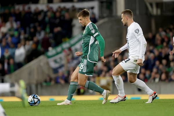 Northern Ireland’s Brad Lyons with Slovenia’s Timi Elšnik during Tuesday’s UEFA Euro 2024 Qualifier at the National Football Stadium at Windsor Park, Belfast.   Photo by William Cherry/Presseye
