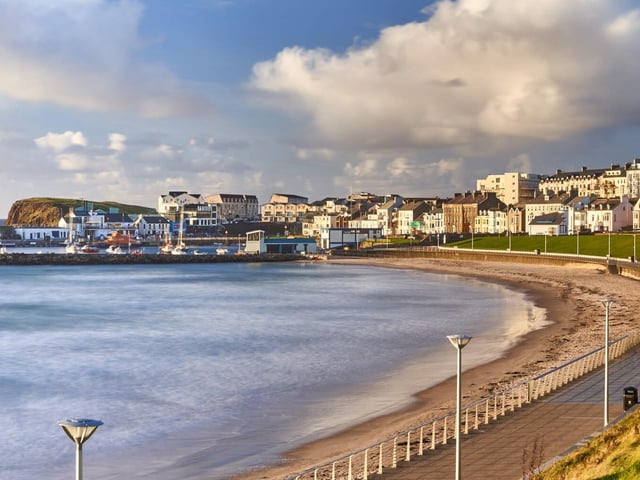 Arguably the most famous seaside town in Northern Ireland, Portrush is a hotspot for tourists and locals alike.
If it’s adventure you’re after, Curry’s Fun Park opens during summer and is a great place for any adrenaline junkies looking for both big and little rides.
A strong drive away, Portstewart’s various beaches are big amongst the surfing community, providing fantastic waves for you to gain momentum and enjoy your time on the board.
Take a wander around the seafront as you dry off and try some cooling ice cream from one of the parlours or have a tipple at a wine bar if that’s more up your street.