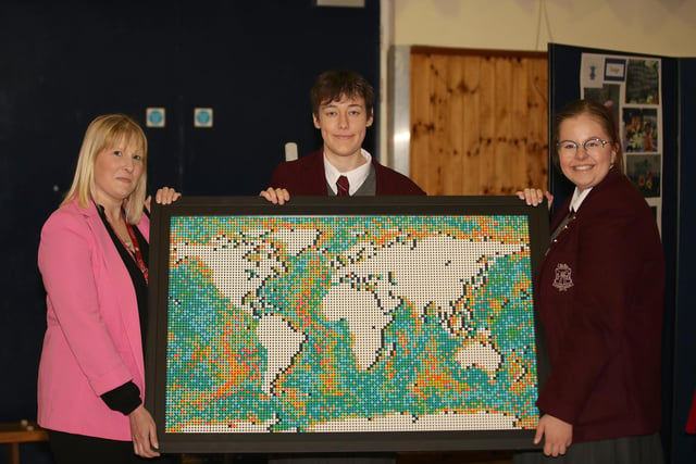 Ulidia IC teacher and pupils showing their artwork ‘Better Together’. The piece was created by Rebecca Telford, a pupil from the school in Carrick. The artwork was made out of lego pieces.  This project was so impressive that the schol received a Carson Bursary.