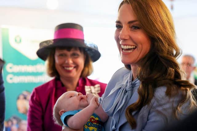 The Princess of Wales holding Isaac Railton during the royal visit to Carrick Connect. Picture by Jonathan Porter/PressEye