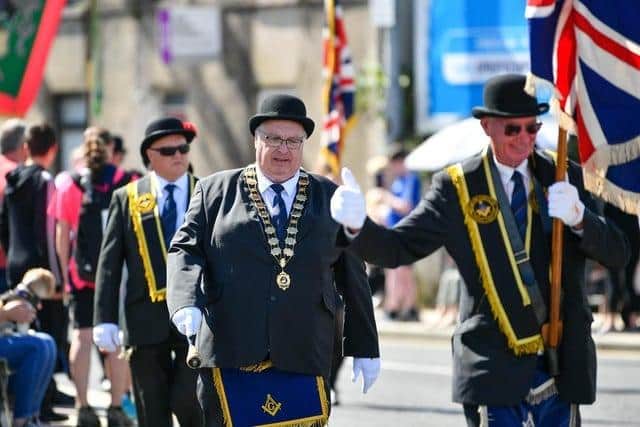 A thumbs up to a familiar face in the crowd from this member of the Royal Black Institution during the Last Saturday parade in Ballyclare in 2022. Picture: Pacemaker