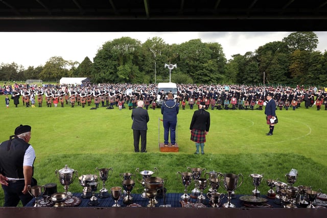 Mayor of Antrim and Newtownabbey, Councillor Mark Cooper, takes the salute at the Ulster Pipe Band and Drum Major Championships at Antrim Forum.
