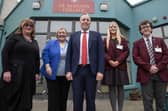 Education Minister Paul Givan with Fiona Kane, principal of St Ronan’s College; Patricia Carville, chair of the board of governors and pupils. Photo: submitted
