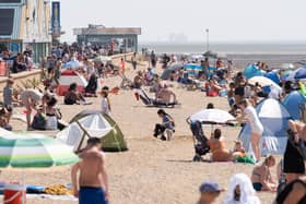 Sun-worshippers will be flocking to beaches in Britain this weekend - but Northern Ireland's to have a more humid time. Photo: Stefan Rousseau/PA Wire