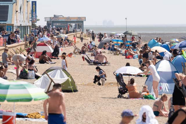 Sun-worshippers will be flocking to beaches in Britain this weekend - but Northern Ireland's to have a more humid time. Photo: Stefan Rousseau/PA Wire