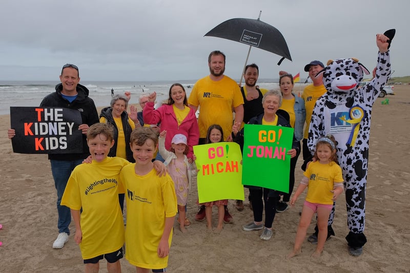 10-year-old twins Micah and Jonah Daffurn finish their 40 mile run over six days on Castlerock Beach and are cheered on by family and friends.