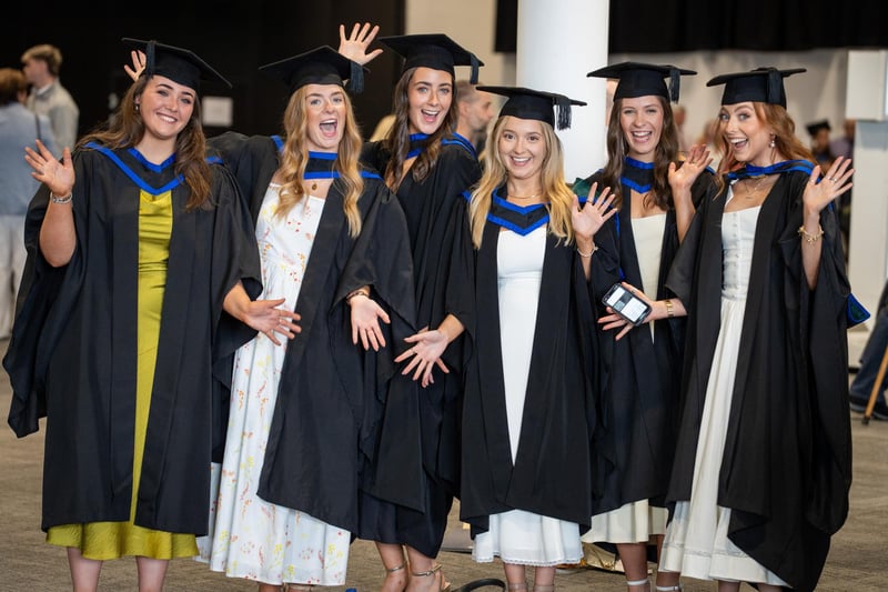 Graduates celebrating academic success at ICC Belfast.