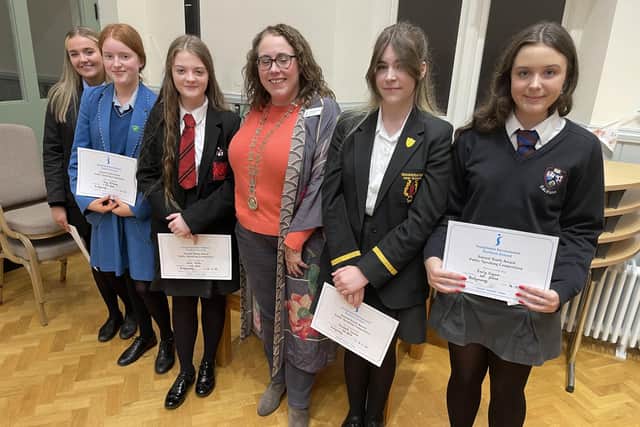 Prizewinners: Emma Doherty, Amy McAuley (joint third), Heidi White, Elizabeth Lennox (joint second), overall winner Emily Sayers from Dalriada with Ballymoney Soroptimist President Sharon McCaffrey. Credit Jennifer Campbell