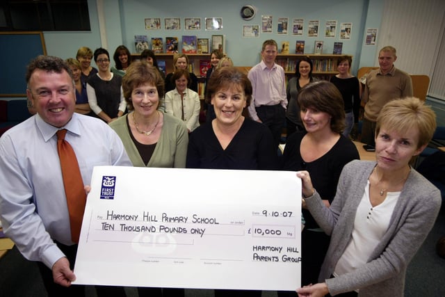 Harmony Hill Primary School's Harry Greer, Rosemary Edgar, Sandra Kay, Irene Whitten, and Jacqueline Lister with a cheque for £10,000 raised by the parents group in 2007 via various fundraising activities in aid of the new library and computer suite