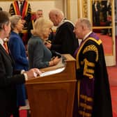 Principal and Portrush man Dr Paul Little CBE chats to Queen Camilla as he receives the Queen's Anniversary Prize for Higher and Further Education on behalf of City of Glasgow College. Credit British Ceremonial Arts Ltd