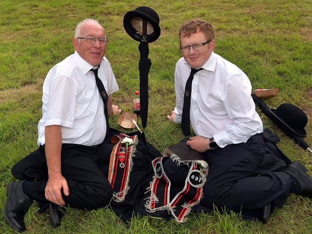 Taking a well-earned break at the RBP Last Saturday parade in Loughgall are farther and son, Jim and Thomas Lennox from Armagh. TH15.