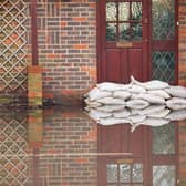 Trying to keep out flood water. Photo: Adobe