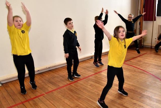 Hart Primary School pupils doing star jumps as part of their exercise programme. PT11-224.