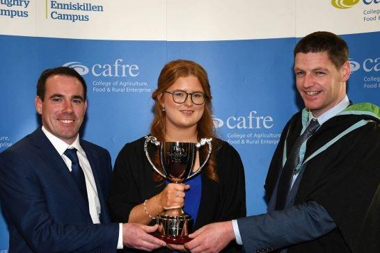 Rebekah Evans (Desertmartin) received the Norbrook Cup for performance in animal health on the Level 3 Advanced Technical Extended Diploma in Agriculture at the Greenmount Graduation Ceremony. Congratulating Rebekah are James Flanagan (Norbrook Laboratories) and John Hamilton (Agriculture Lecturer, CAFRE).