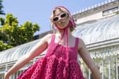 Designer Ariane Sloan modelling her handcrafted dress outside Belfast's Botanic Gardens.