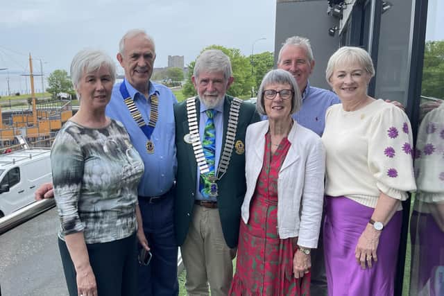 Marking the 50th anniversary, from left to right, are: Hilary Johnstone; John Johnstone, Club President; Gerald Cashman, District Governor; Mary Cashman, Martin Ellis and Ann Ellis.