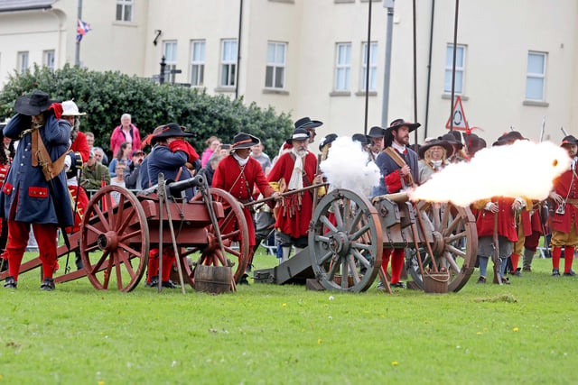 Live cannon and musket firing was part of the spectacle in Carrickfergus on bank holiday Monday.