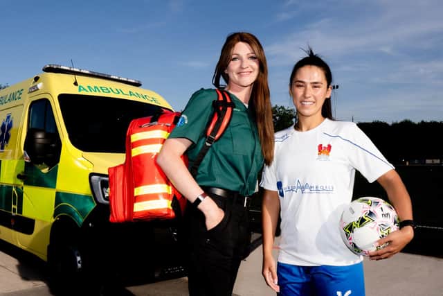 Megan Hamill, Proparamedics, is pictured with Christine Clews, Captain of Lisburn Ladies Football Club, Pic credit: Proparamedics